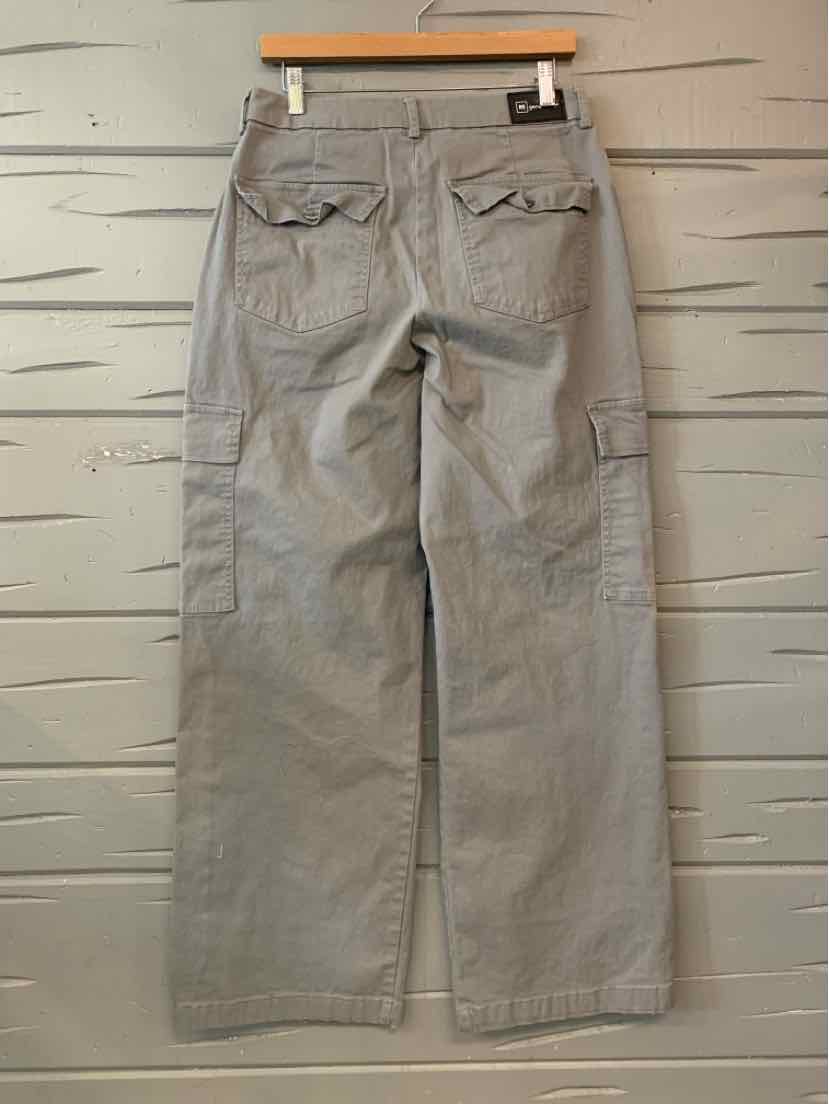 Gray women’s cargo pants with a relaxed straight-leg fit, multiple flap pockets, and a buttoned waistband.