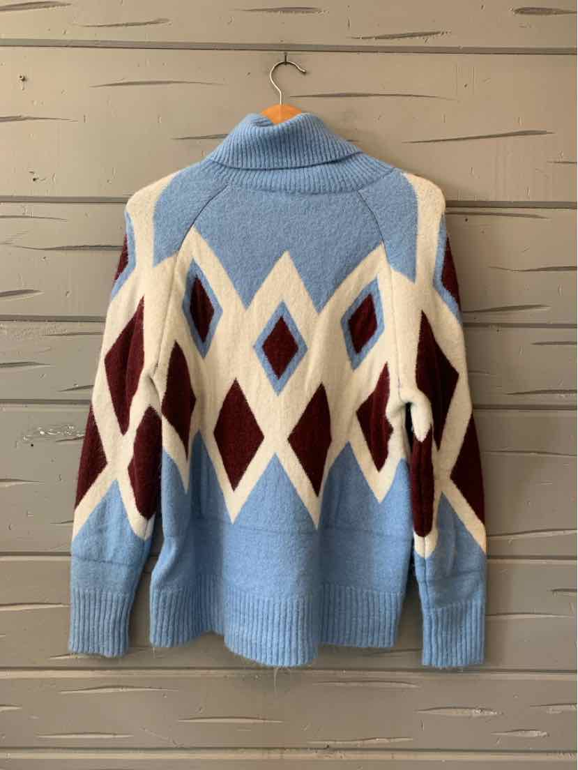 Blue knit sweater with cream and burgundy argyle diamonds, long sleeves, and a folded collar.