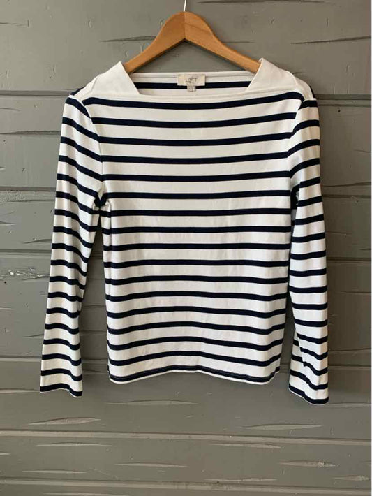 White long-sleeve shirt with navy horizontal stripes and a boat neckline on a wooden hanger.