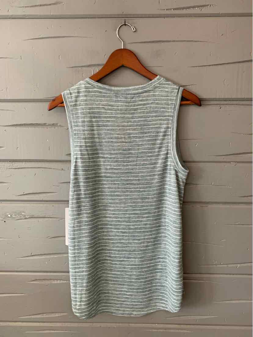 Light gray and white striped sleeveless athletic tank top with crew neckline hanging on wooden hanger.
