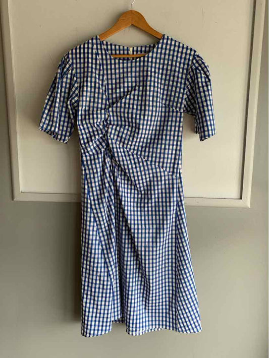 Blue and white gingham short-sleeve dress with ruched front detail and knee-length hem.