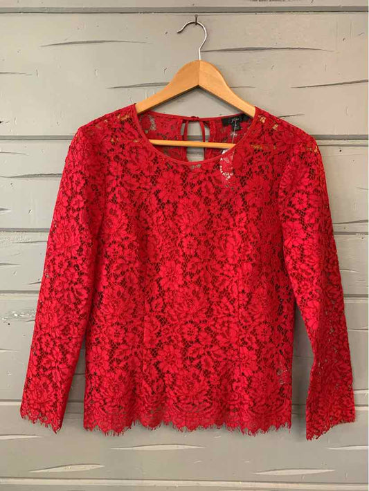Red lace long-sleeve top with floral pattern and keyhole back detail, size 4.