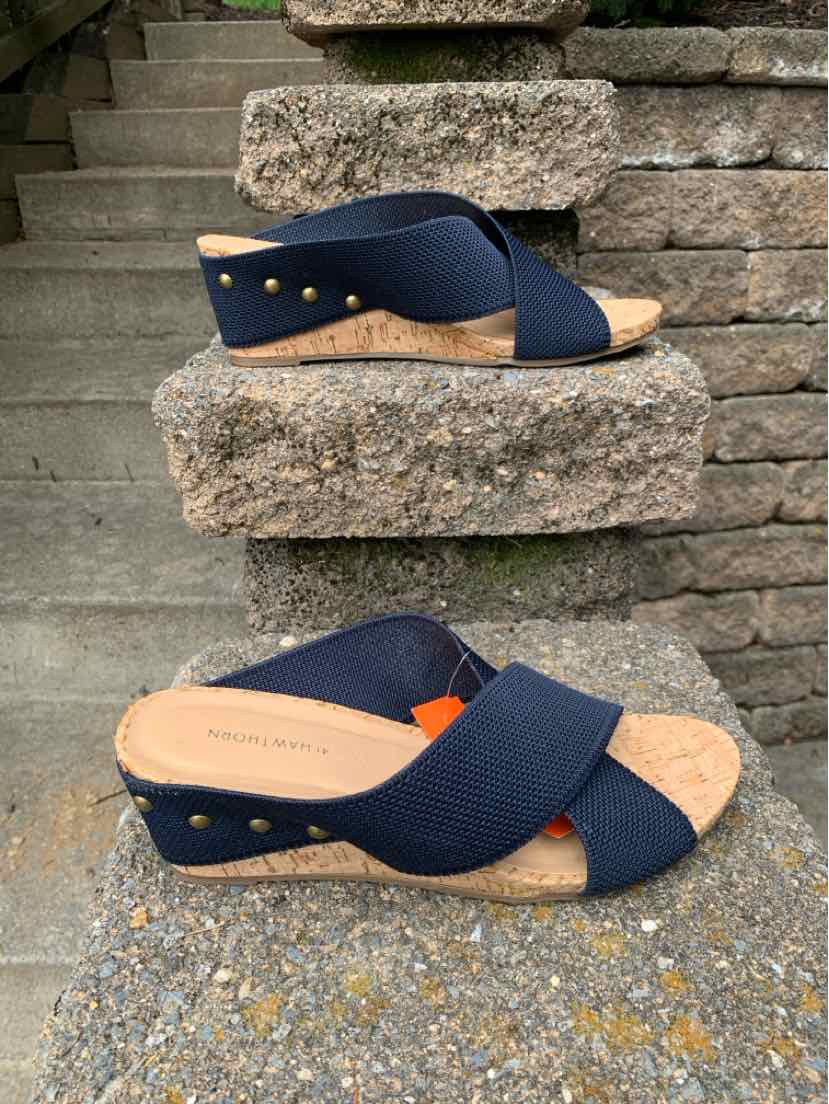 Navy blue cross-strap sandals with cork wedge soles and gold stud accents, size 10.