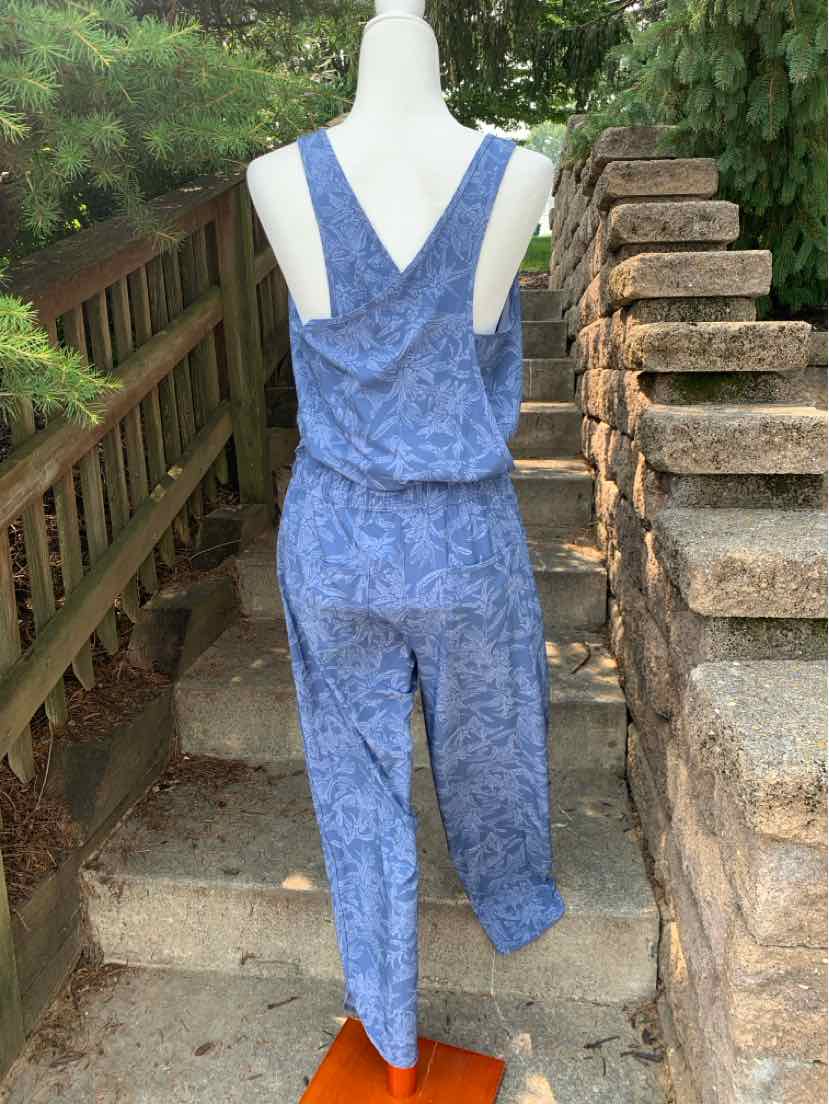Blue sleeveless Patagonia jumpsuit with V-back and subtle all-over pattern, medium size.