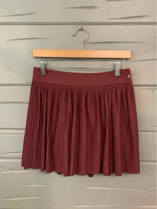 Burgundy pleated mini skirt with wide waistband, medium size, solid fabric.