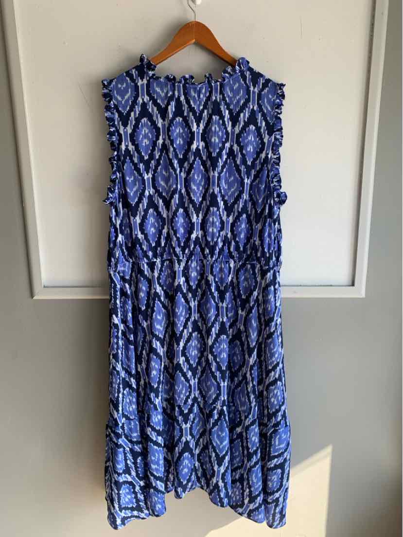 Sleeveless blue and white patterned maxi dress with round neckline on wooden hanger.