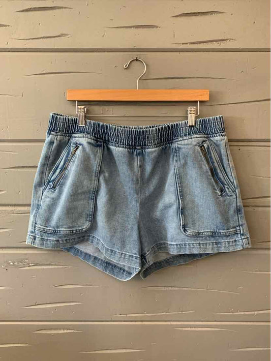 Light blue denim shorts with elastic waistband and front zippered pockets, size XL.