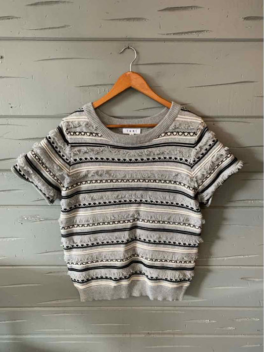 Gray short-sleeve knit sweater with horizontal black and white stripe patterns and ribbed cuffs and hem.