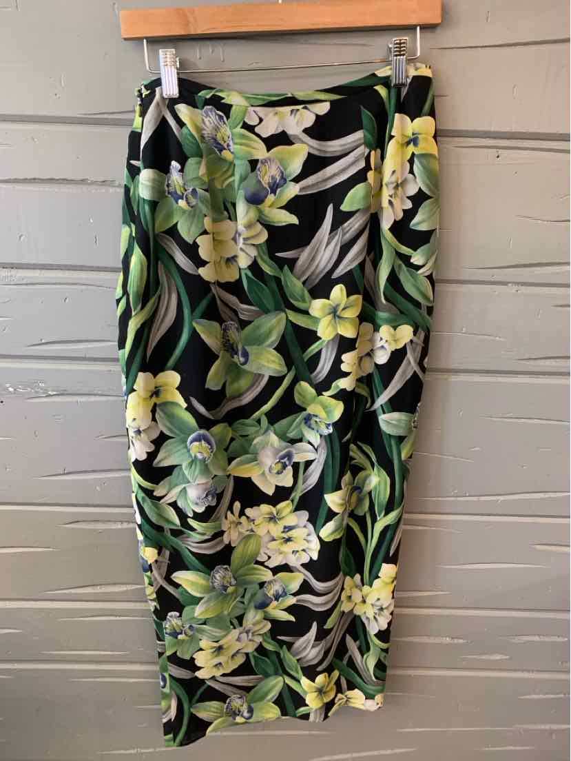 Black floral pencil skirt with green and yellow tropical leaves, knee-length, fitted style.