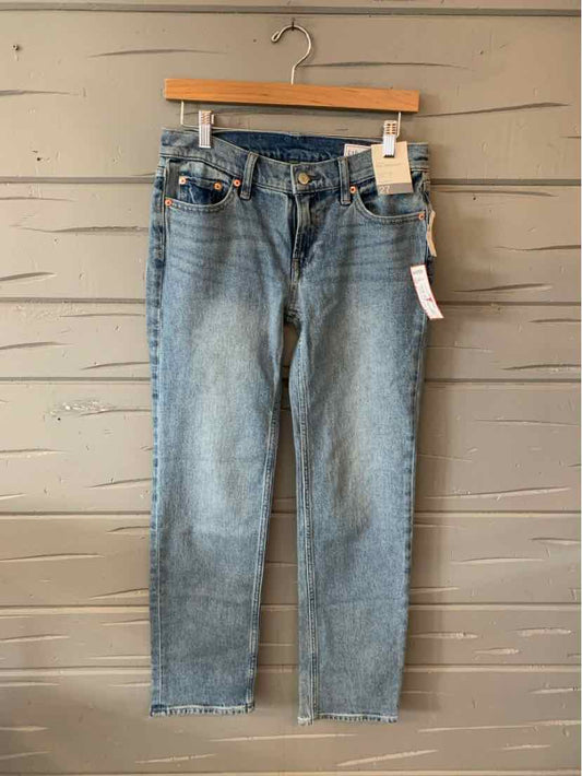Light blue slim-fit denim jeans with five-pocket design and button closure, size 4.