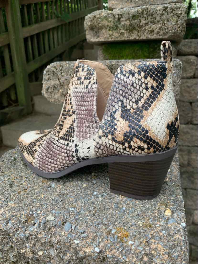 Ankle boot with brown, beige, and black snakeskin pattern, stacked block heel, and elastic side panels.