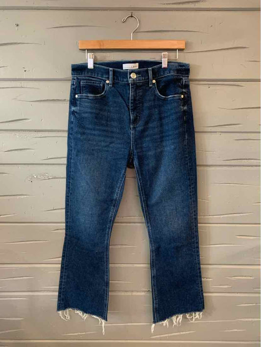 Dark blue denim jeans with raw hem and slight fading, size 8, straight-leg cut.