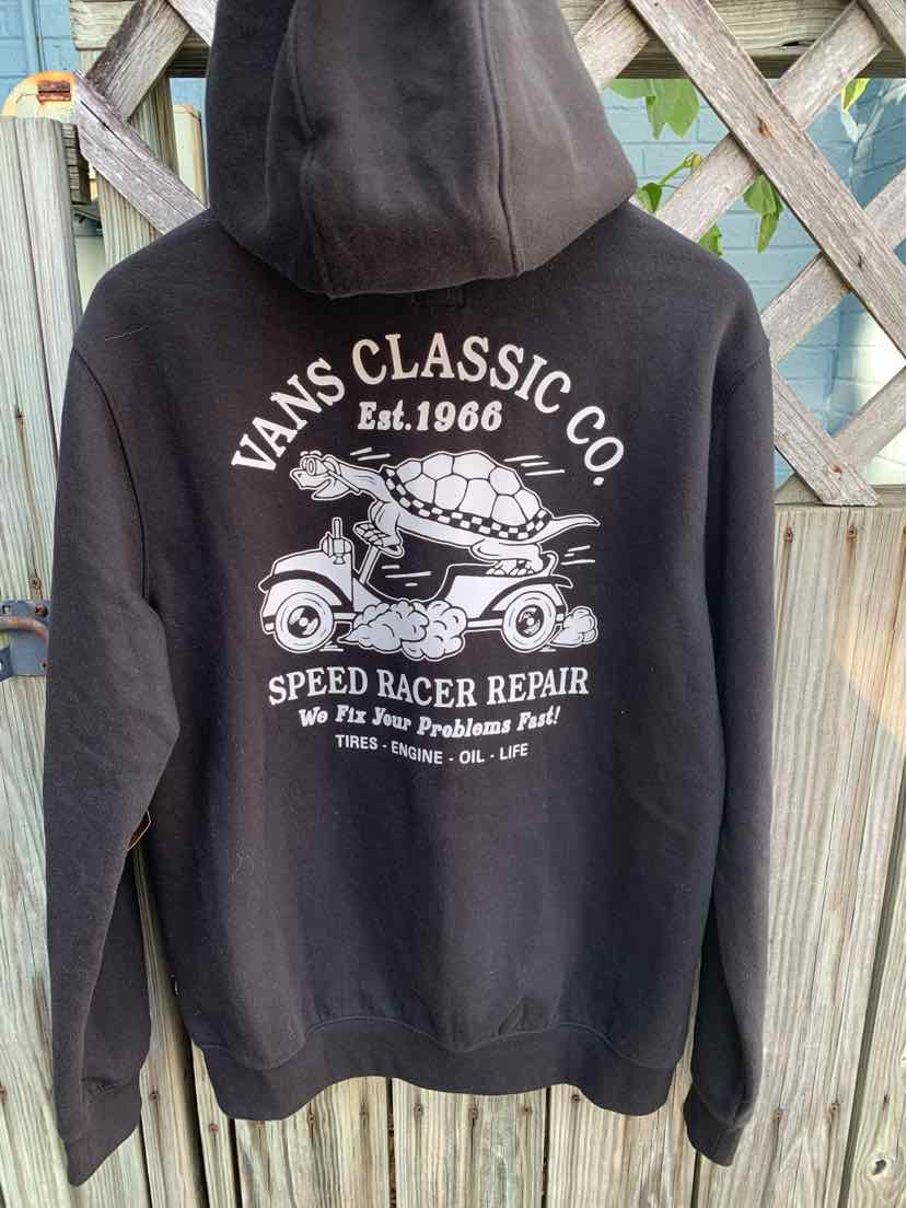 Black Vans hoodie with a white vintage car graphic and "Vans Classic Co" text on the back.