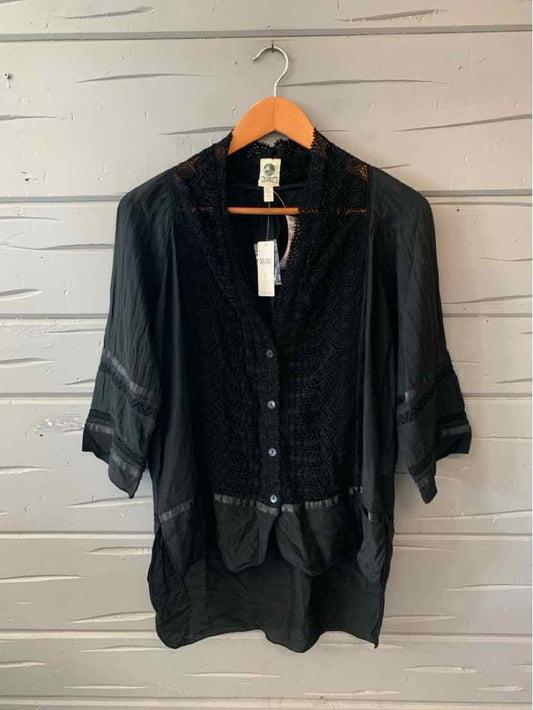 Black lightweight blouse with lace detailing and three-quarter sleeves on wooden hanger.