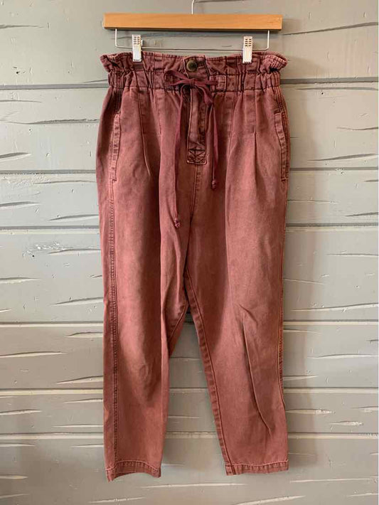 Burgundy high-waist paperbag trousers with a tie belt and tapered legs in size XS.
