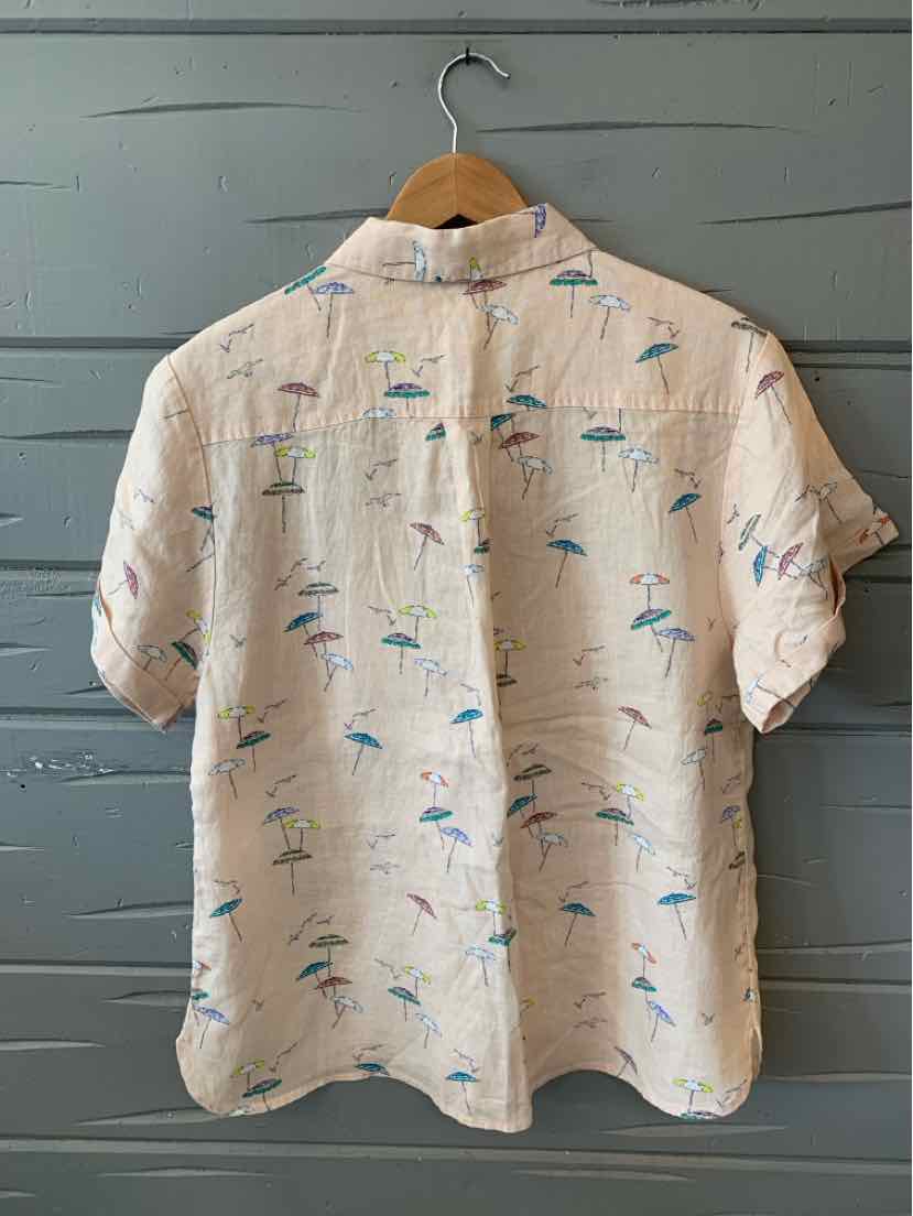 Light beige short-sleeve button-up shirt with blue and green beach umbrella print.