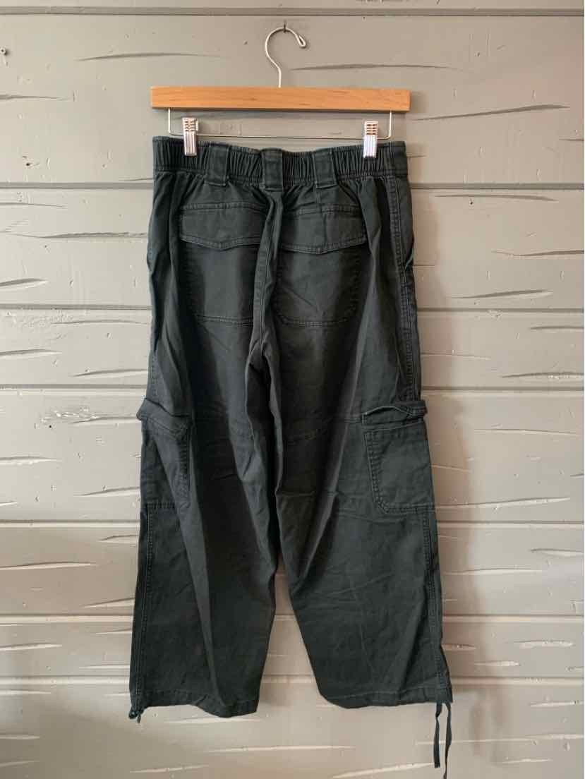 Black cargo pants with multiple pockets and adjustable drawstrings at the hem, laid-back fit.
