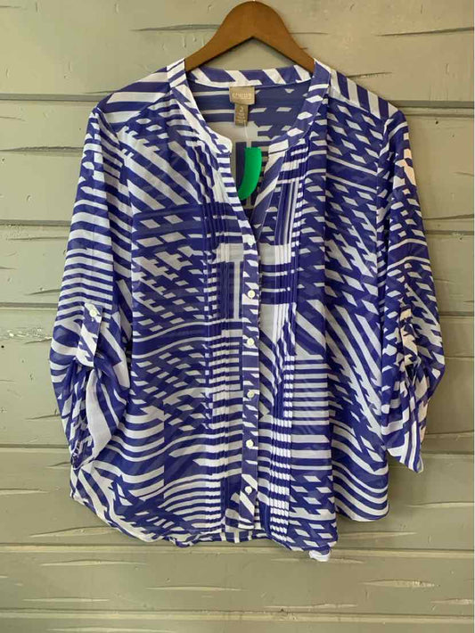 Blue and white geometric patterned loose blouse with roll-tab sleeves and buttoned front.