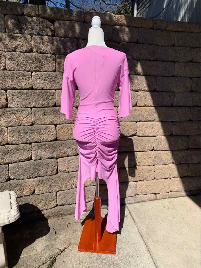 Pink ruched midi dress with three-quarter sleeves and asymmetrical hem on a mannequin.