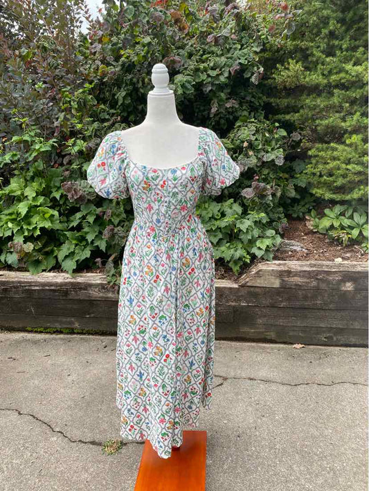 Floral midi dress with puff sleeves, square neckline, and fitted waist in multicolor on white background.