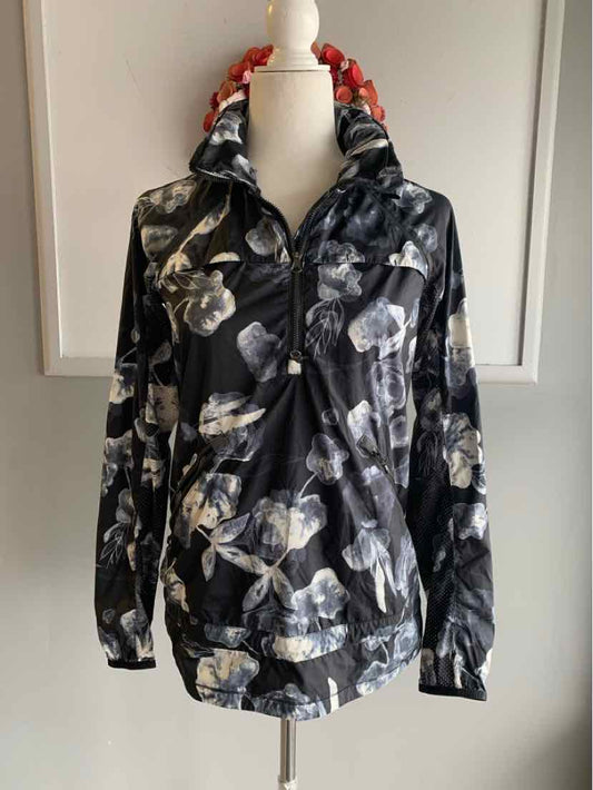Black floral Lululemon hooded jacket with front zipper and elastic cuffs, size 4.