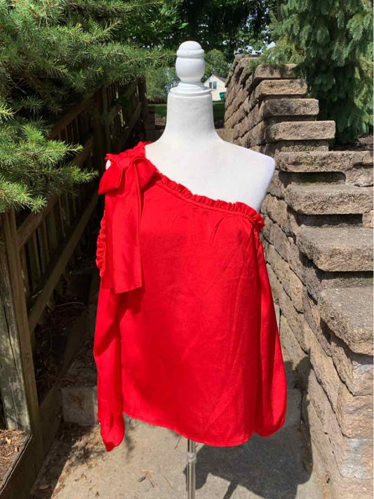 Bright red one-shoulder blouse with long sleeve and large bow detail on shoulder.
