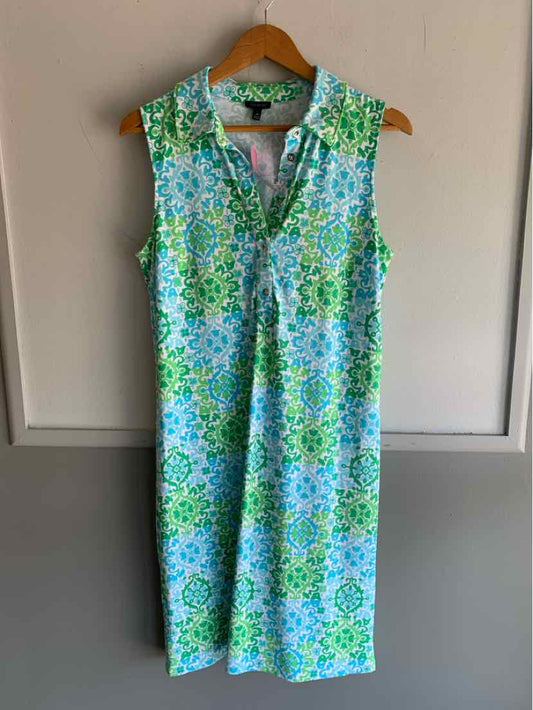 Sleeveless knee-length dress with blue, green, and white floral pattern and a V-neck collar.