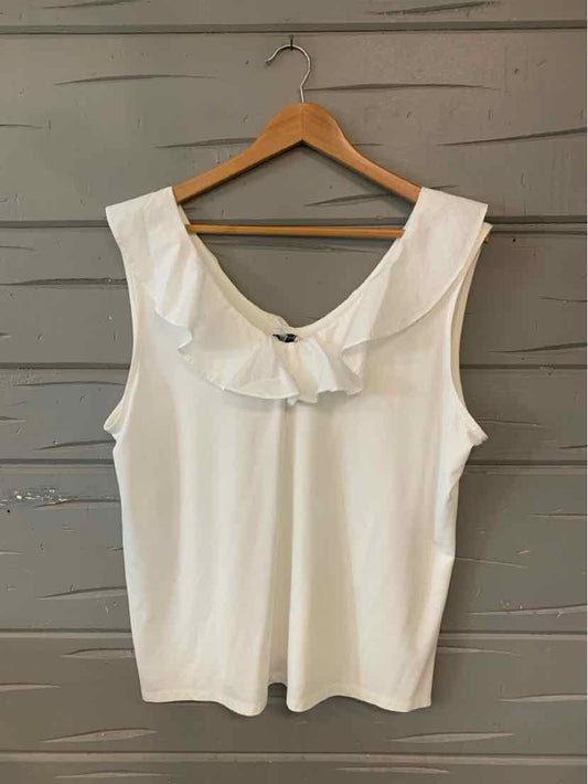 White sleeveless top with ruffled V-neckline in size XL hanging on wooden hanger.