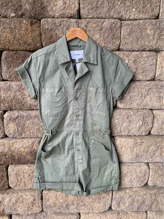 Olive green short-sleeve utility romper with collared neckline and front button closure.