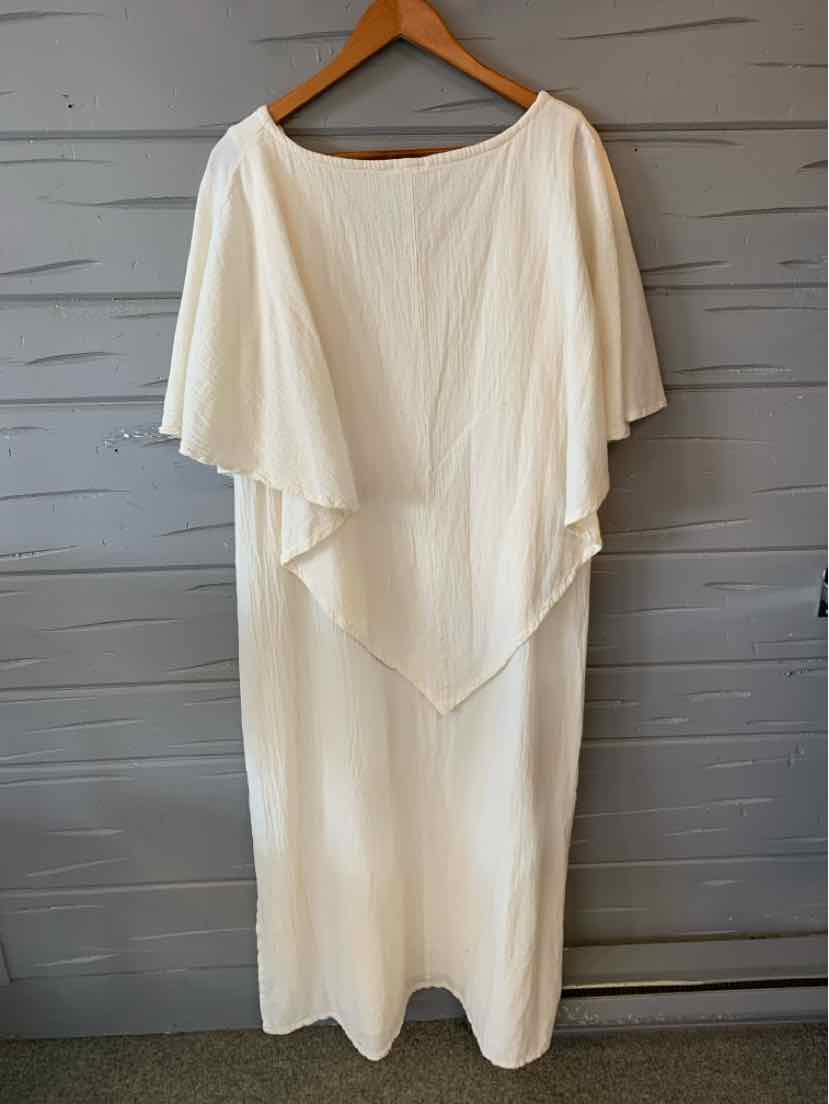 White lightweight gauze midi dress with wide boat neckline and layered draped cape sleeves.
