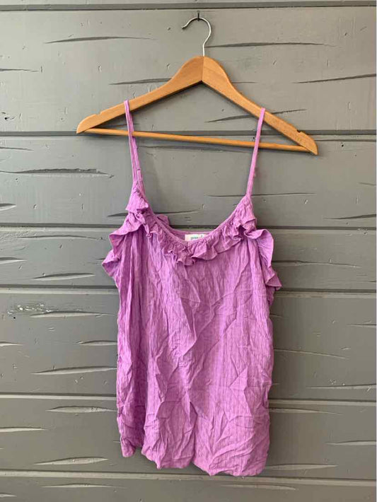Lavender sleeveless lace-trimmed camisole with ruffle detail on wooden hanger.
