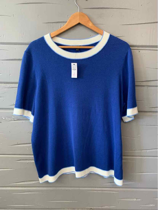 Blue short-sleeve sweater with white trim on collar, cuffs, and hem, size 2X.