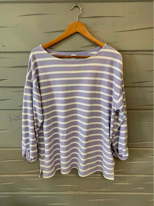 Lavender and white striped long-sleeve shirt with a scoop neckline on a wooden hanger.