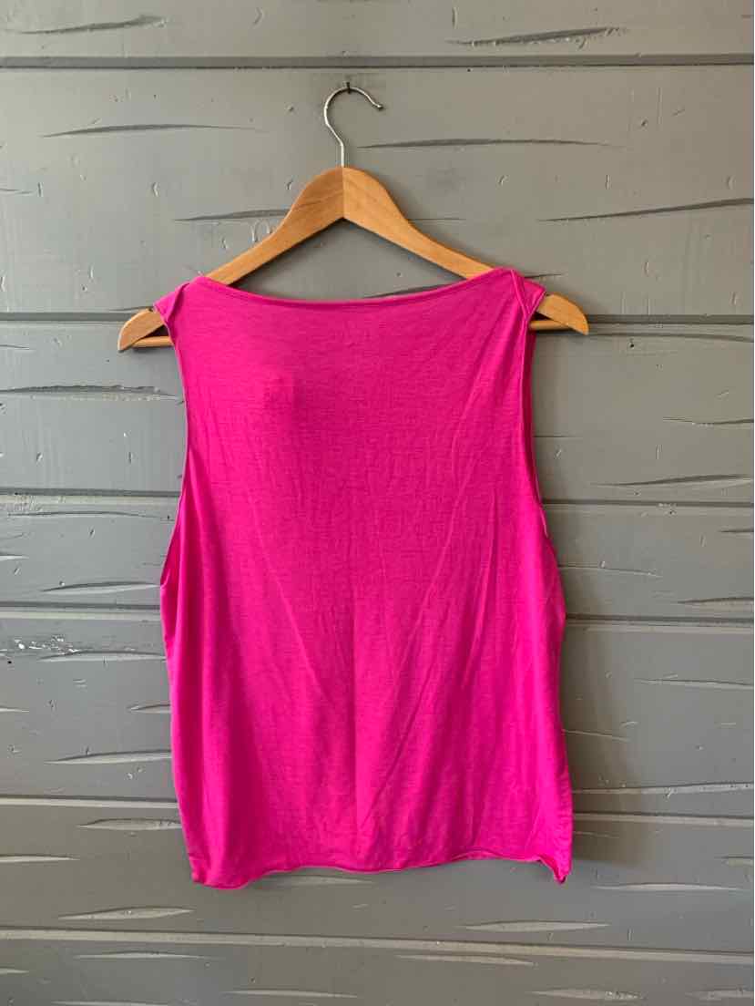 Bright pink sleeveless athletic tank top with wide shoulder straps on a wooden hanger.
