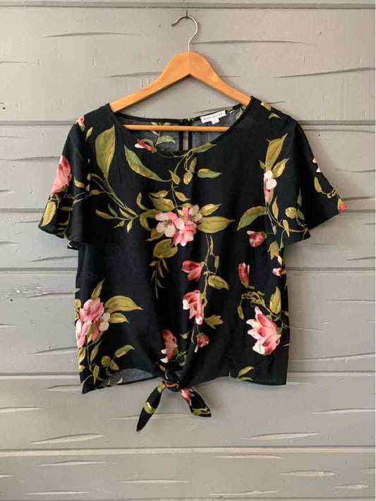 Black short-sleeve blouse with pink floral print and front tie detail, size small.