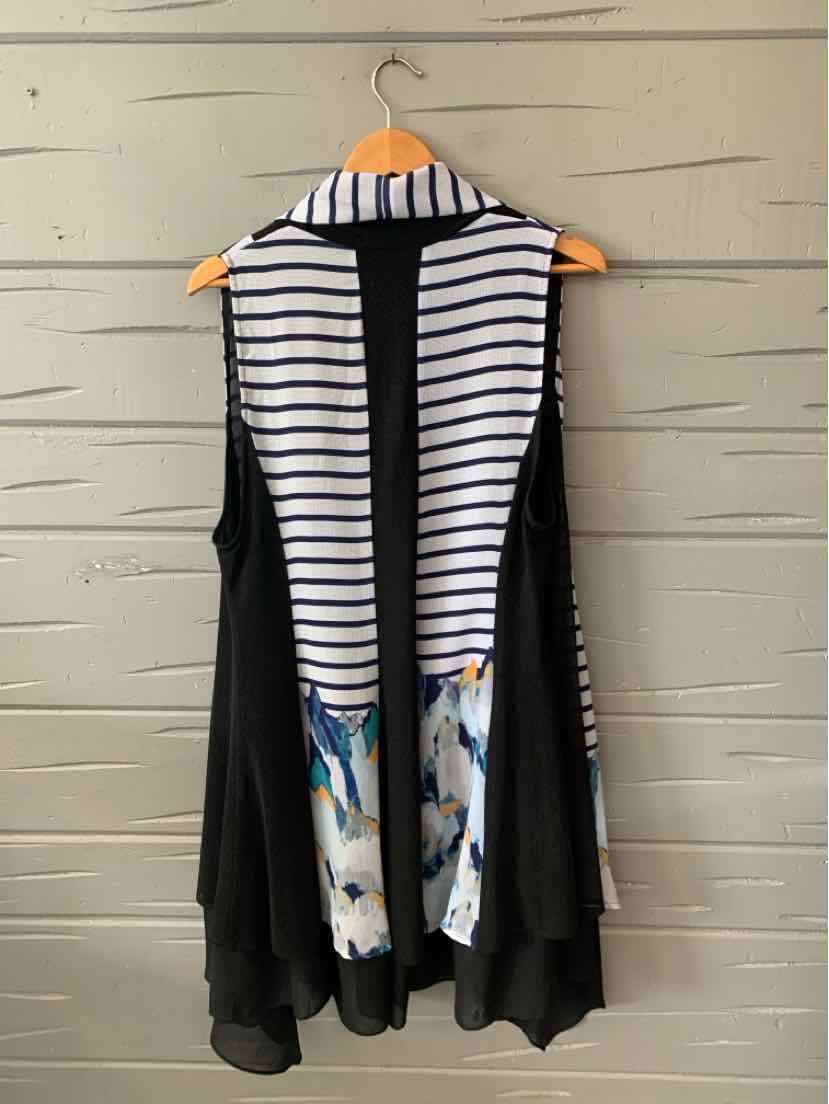 Black sleeveless cardigan with open front, white and navy striped back panel, and colorful abstract print at the lower back.
