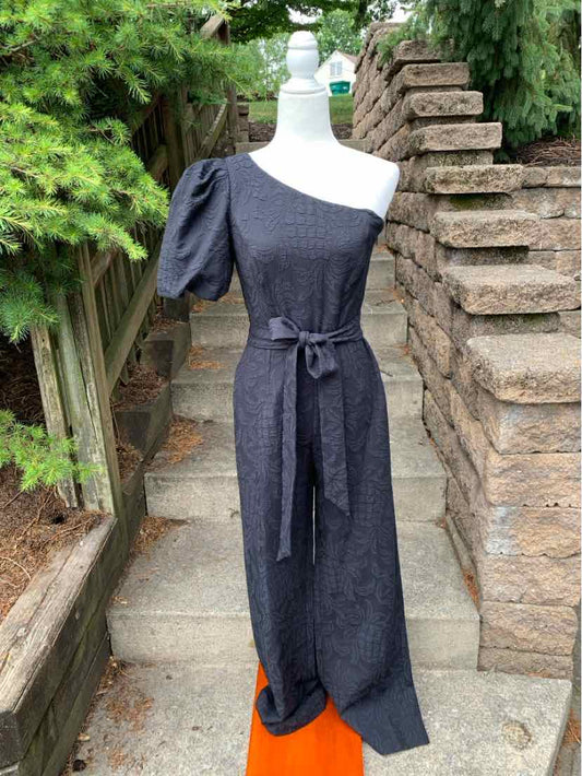 Black jacquard one-shoulder maxi dress with puffed sleeve and waist tie belt.