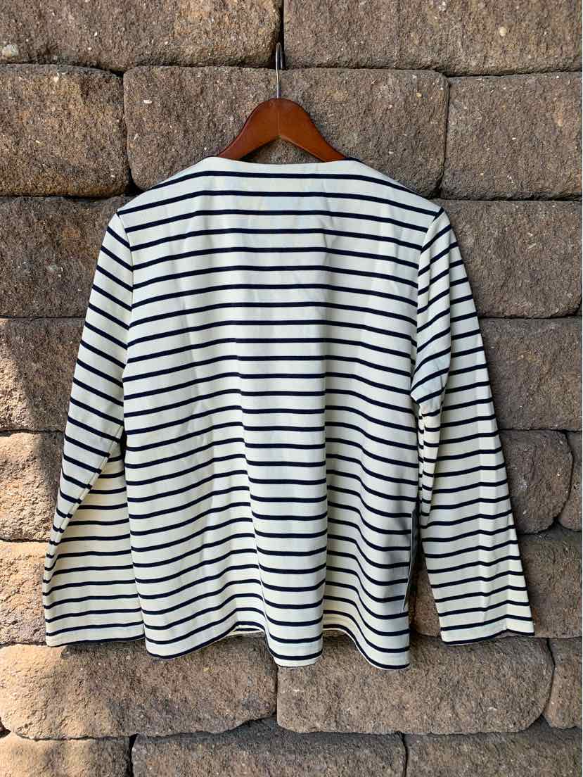 Women's long-sleeve white shirt with black horizontal stripes, size XL, hanging on wooden hanger.