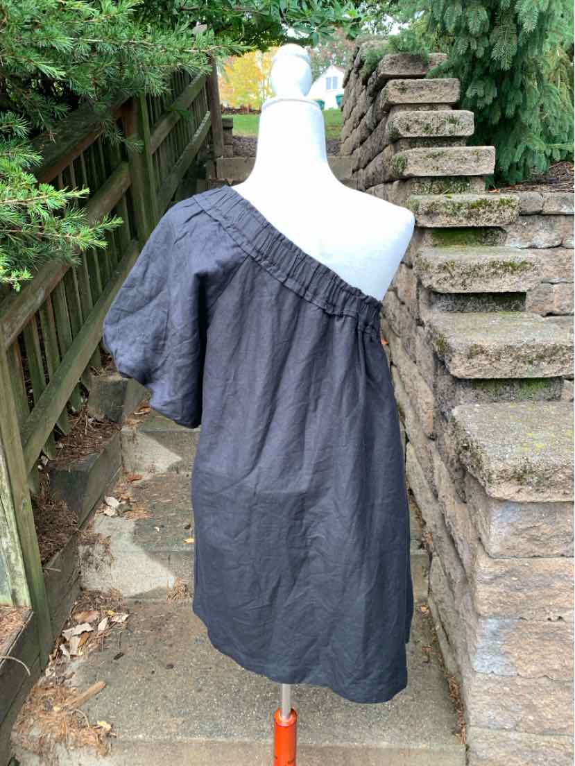 Anthropologie women’s charcoal black dress with a gathered neckline, short puff sleeves, and relaxed fit.