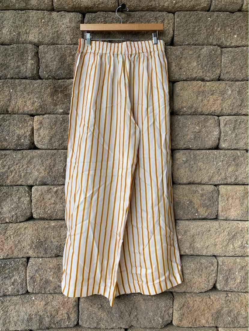 Light beige wide-leg pants with vertical pink and orange stripes, elastic waistband, lightweight fabric.