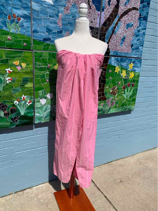 Pink strapless maxi dress with a slight front slit, lightweight fabric, relaxed fit.