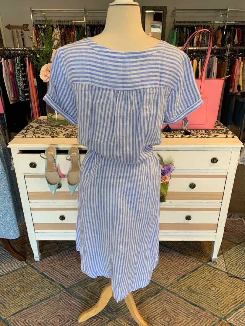 Blue and white striped short-sleeve dress with cinched waist and round neckline on mannequin.