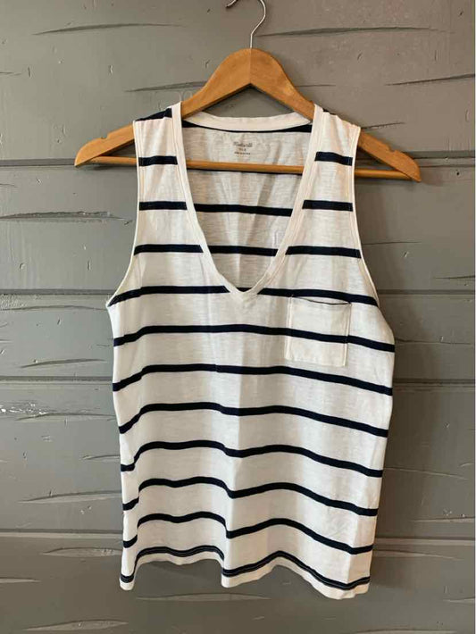 White tank top with navy horizontal stripes and V-neck on wooden hanger.