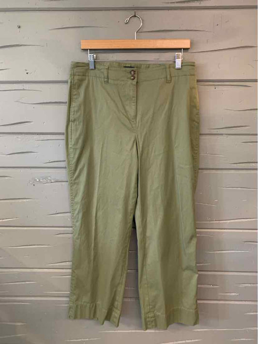 Olive green cropped pants with front button and zipper closure, belt loops, and straight leg design.