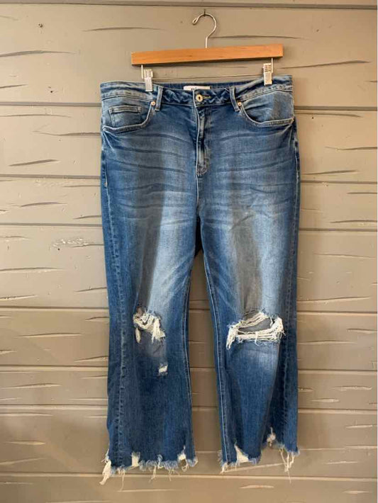 Blue denim jeans with distressed knees and frayed hems, size 14, straight-leg fit.