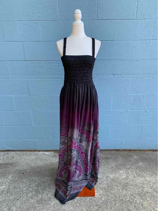 Black and purple smocked maxi dress with floral paisley pattern and wide straps.