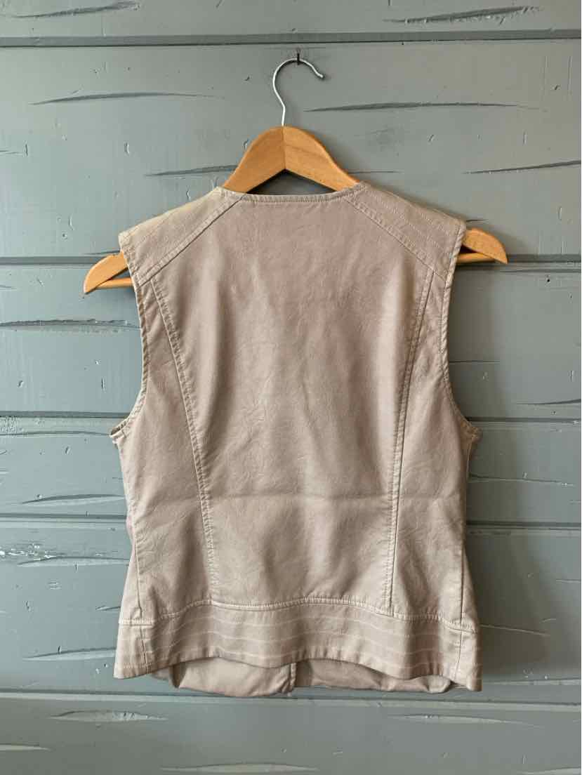 Beige leather sleeveless vest with structured seams, small size, hanging on wooden hanger.