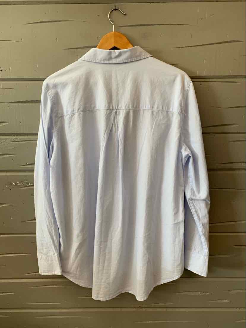 Light blue long-sleeve button-up shirt with a pointed collar in XL size hanging on wooden hanger.