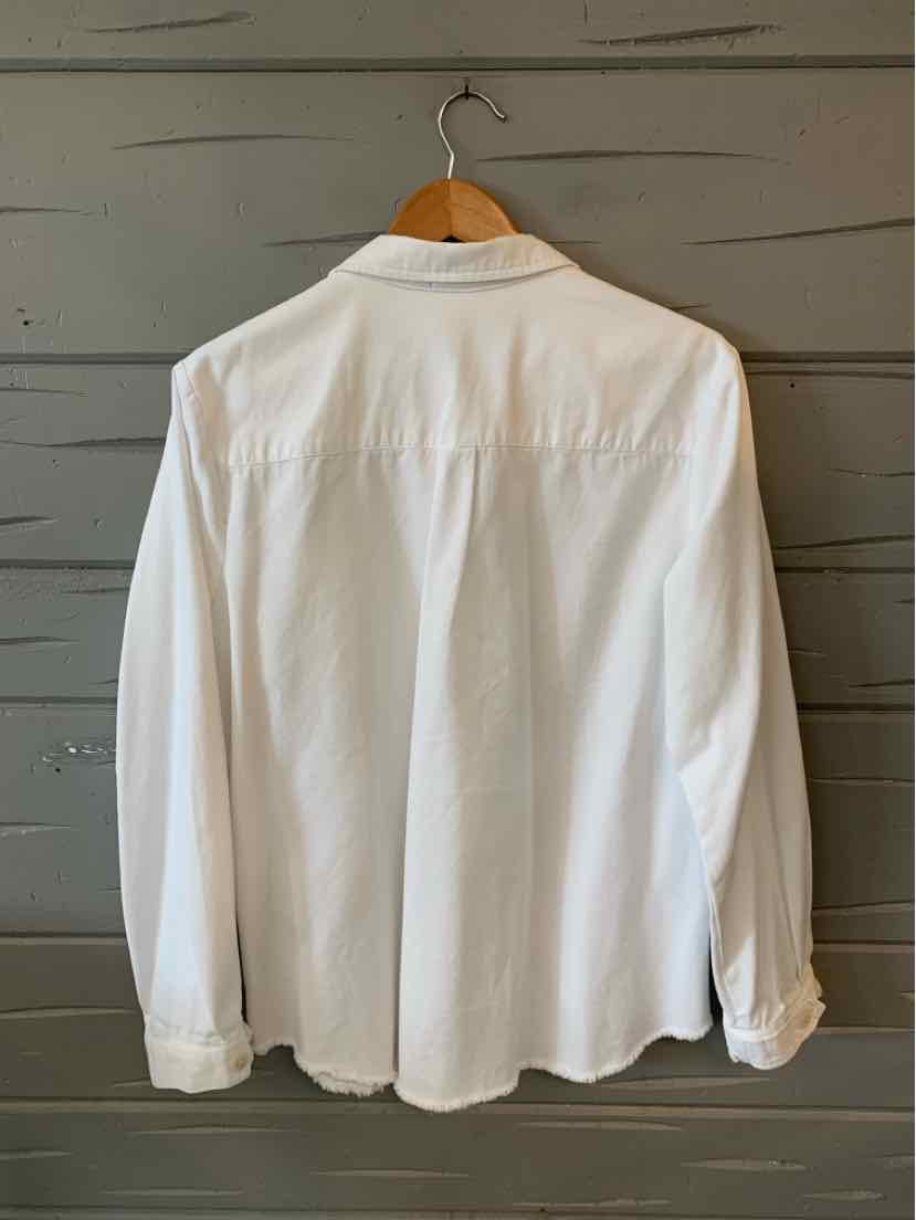 White long-sleeve button-up shirt with classic collar and straight hem hanging on wooden hanger.