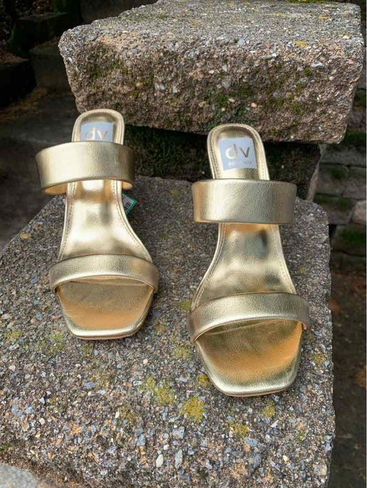Metallic gold open-toe slide sandals with two wide straps and square toes, size 6.5.